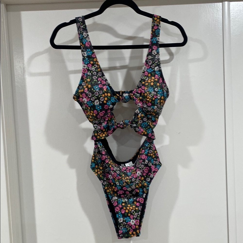 Celebrity Pink Black and Pink One Piece Swimsuit Cut-Out Design